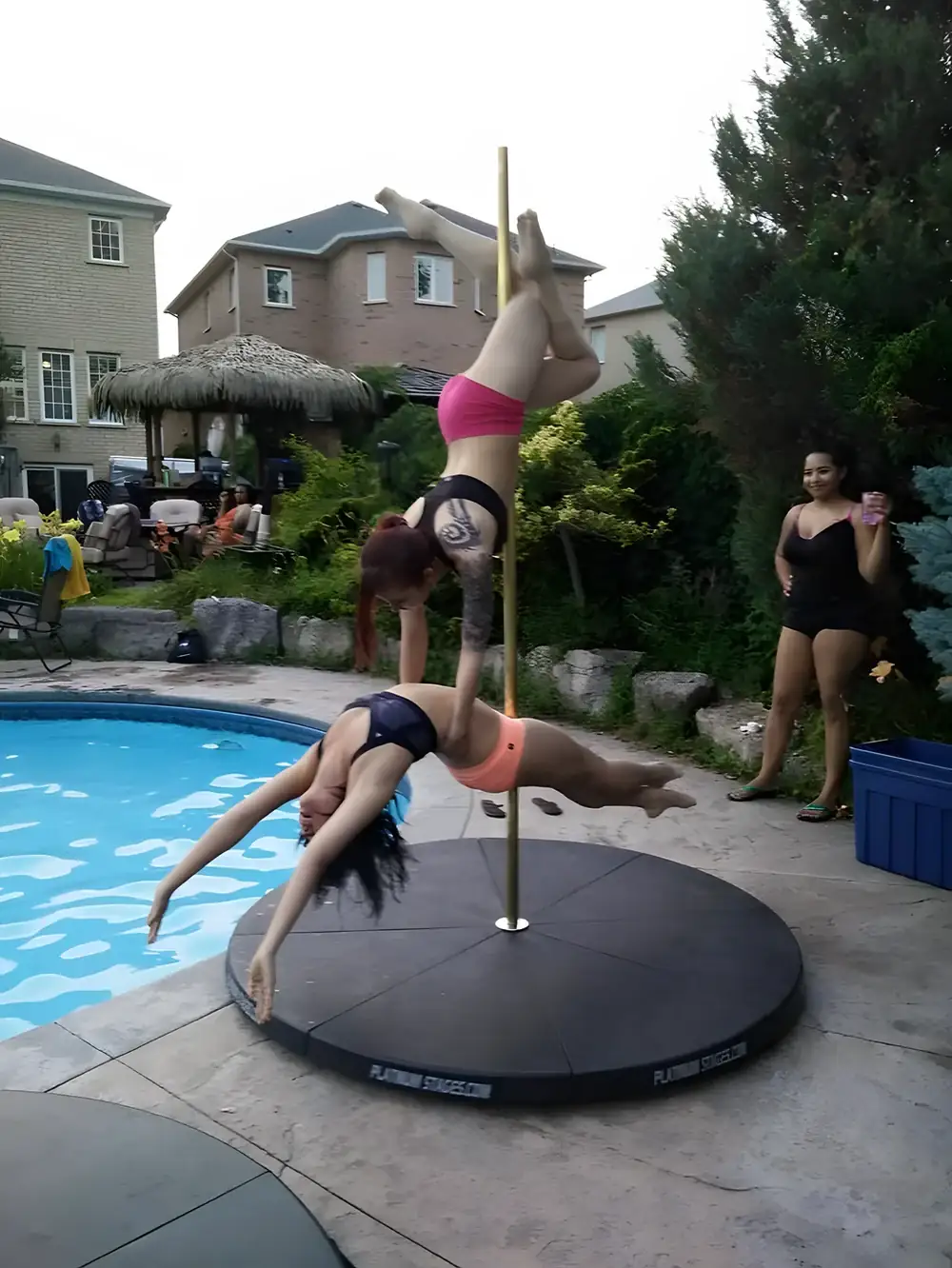 Self-standing dance pole set up outdoors at a backyard party